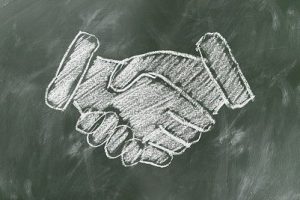 deal handshake mergers and acquisitions